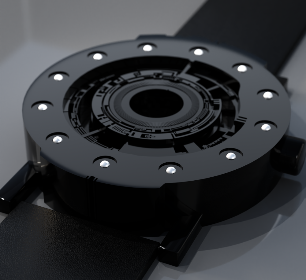 UnconstrainedTime Techno-circle-1- in black anodised aluminium on a grey surface.