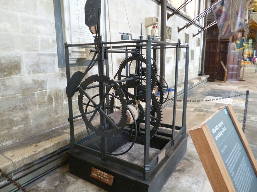 The Old Clock at Salisbury Cathedral, with an information board in front of it.