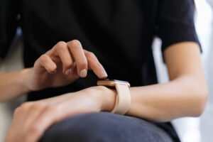 smartwatch worn by young woman