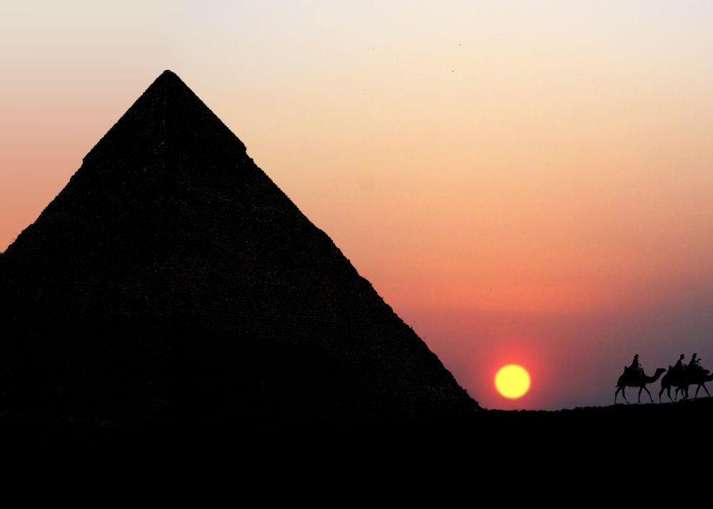 Egyptian Pyramid with sunset and camels
