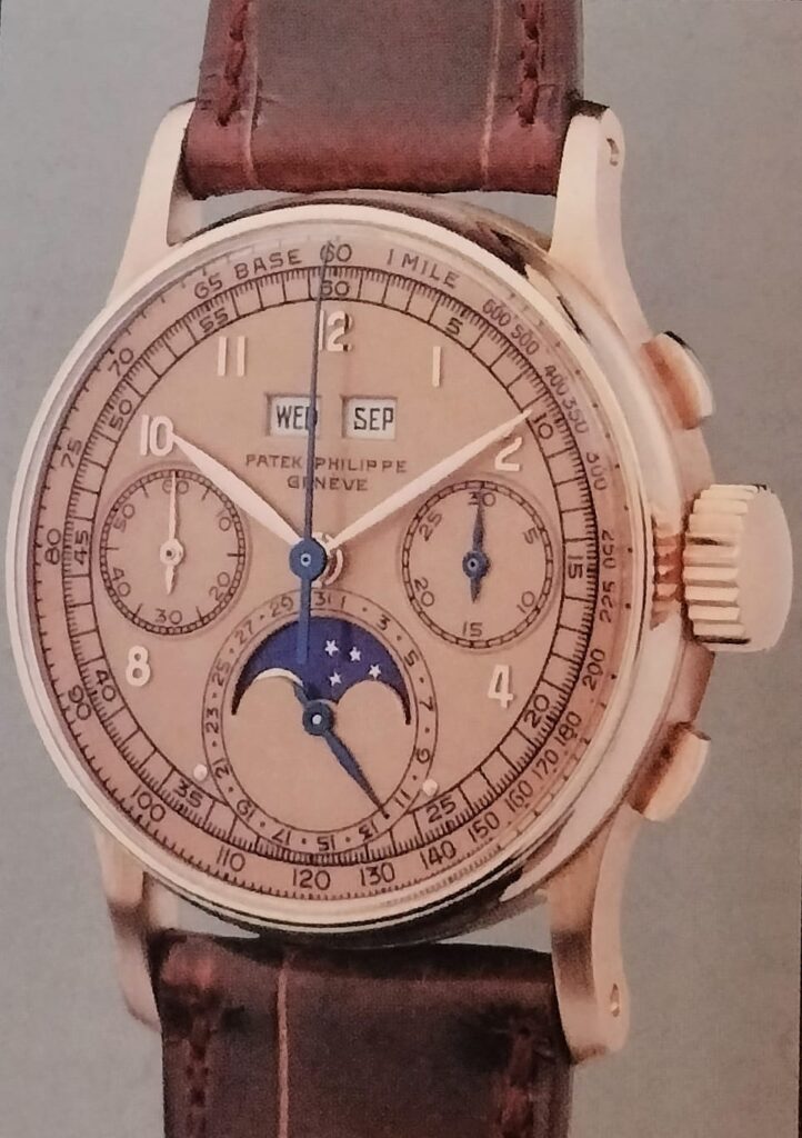 Patek Philippe cronografo calendario perpetuo ref. 1518, metà anni '40 circa, rose gold, on grey background.