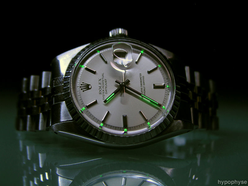Rolex Datejust watch, on reflective surface