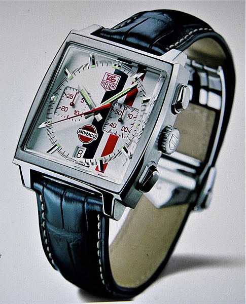 TAG Heuer Monaco aesthetic watch, 3/4 vertical view, on white surface