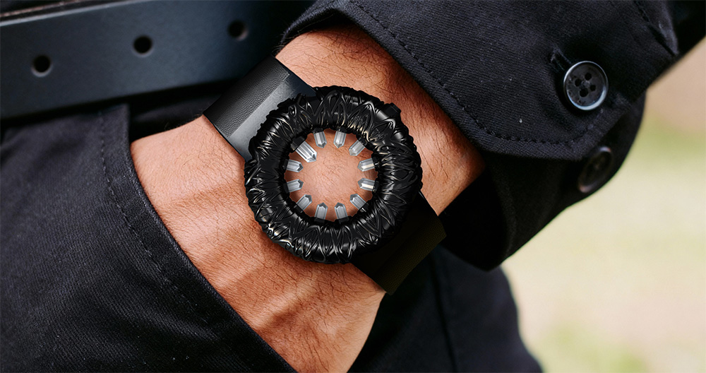 Tropical Crystal watch in black, worn on a man's wrist.