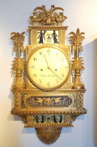 Wall clock, signed by Wilhelm Pauli, Stockholm, c. 1800, carved and gilt wood - Nordiska museet - Stockholm, Sweden