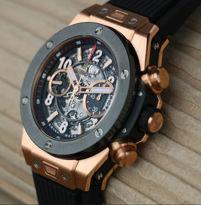 Hublot Big Bang Unico King Gold, a limited-edition watch, on wood surface