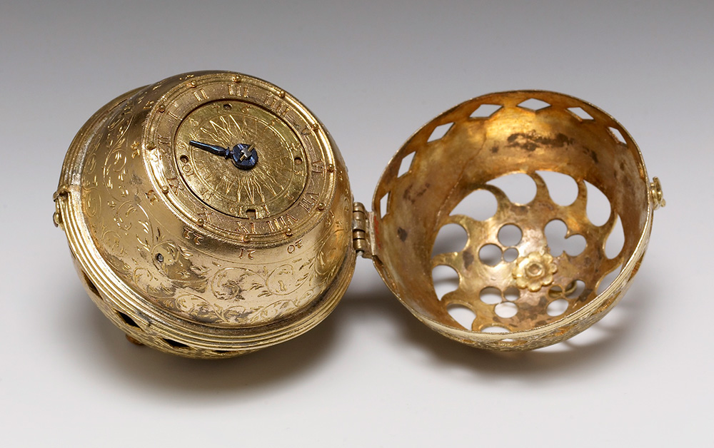 Spherical table watch, on white surface
