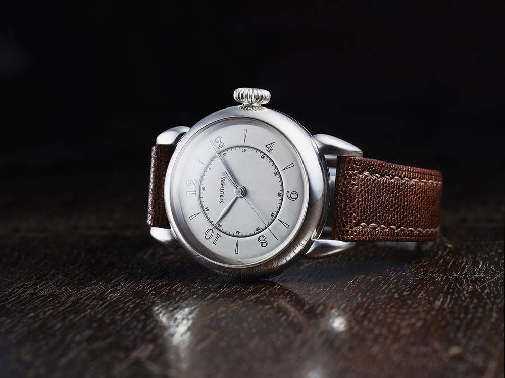Struthers watch, on wooden table 