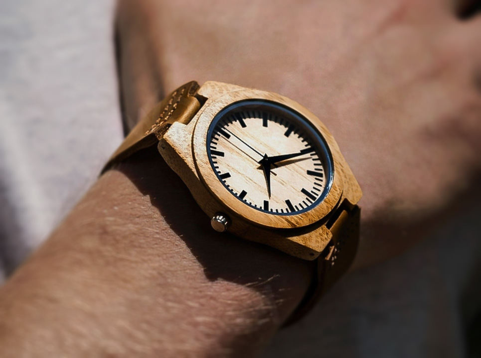 Tree Hut watch in pale wood, worn on a wrist.