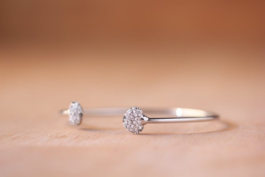 fine jewellery example, silver with transparent gemstones, shallow depth of field