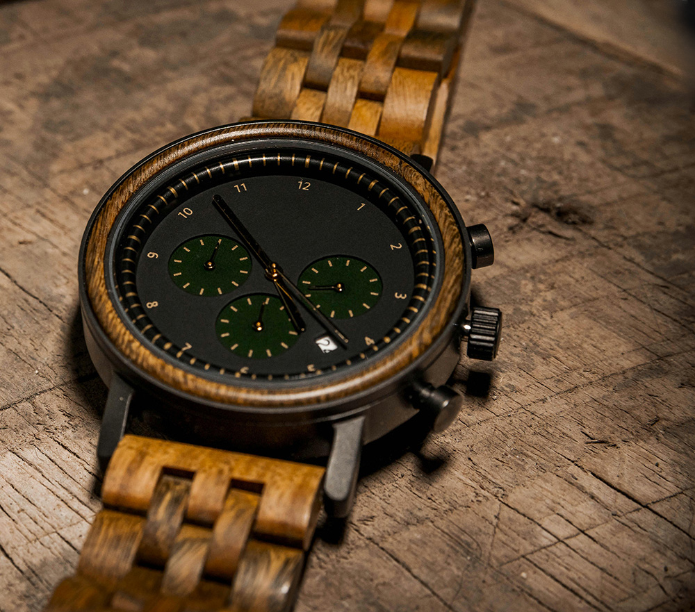 Wood Watch with black dial, on a wood surface