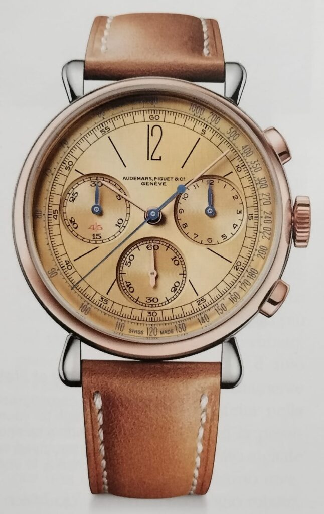 Audemars Piguet Remaster01 watch,  rose gold with gold dial and grey-blue hands, view from above, on grey background