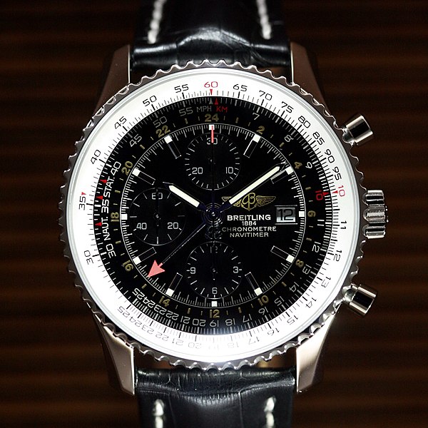 Breitling Bentley watch with black and white dial, against dark brown background