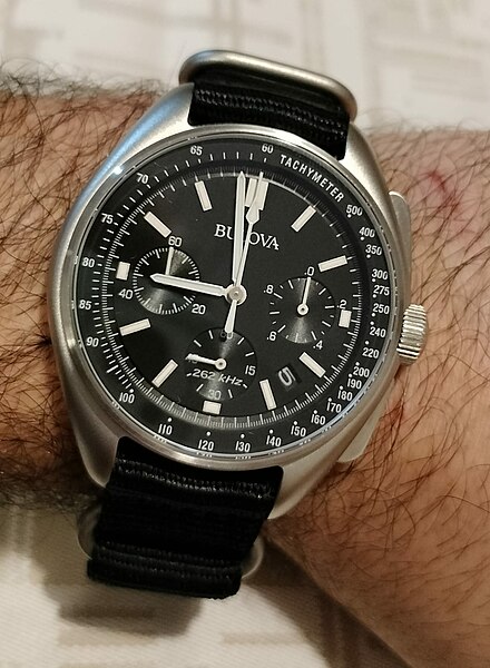 Bulova Lunar Pilot watch used during the Apollo 15 mission, black dial, shown worn on a man's wrist
