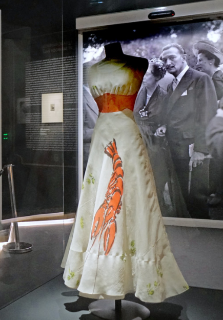 wearable art by E. Schiaparelli and S. Dali, shown on a mannequin in a museum.