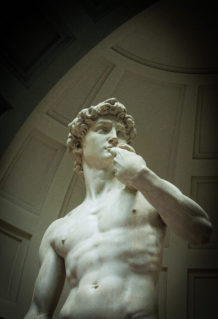 Michelangelo's "David" statue, a reproduction shown in an art gallery.
