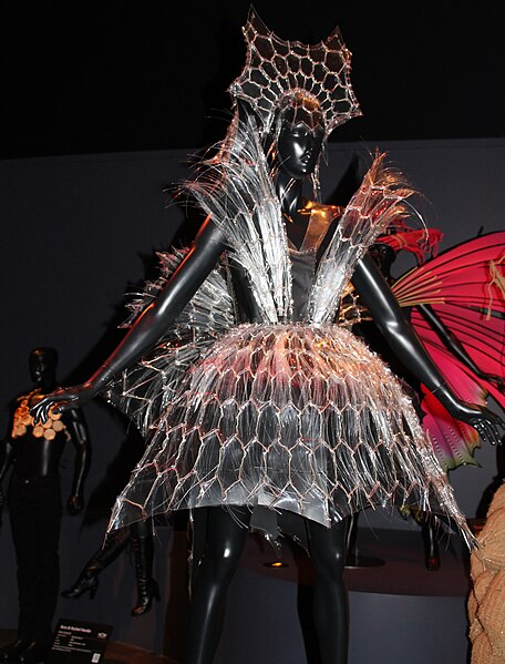 wearable art, transparent fabric, on a mannequin, dark background