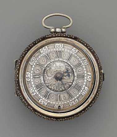 decorated watch, viewed from above - watch aesthetics, on grey background.