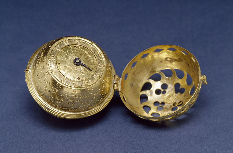 Pomander watch - Nuremberg Egg - with baroque ornamentation, on blue surface.