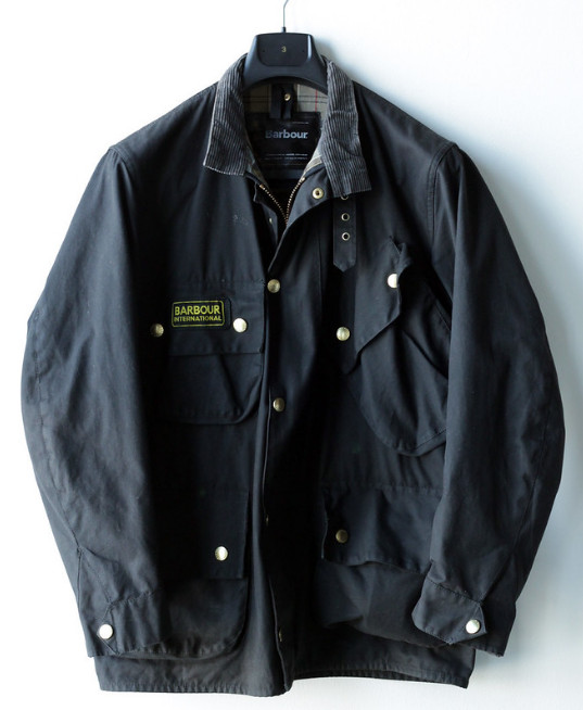 Barbour dark jacket - A British luxury brand.