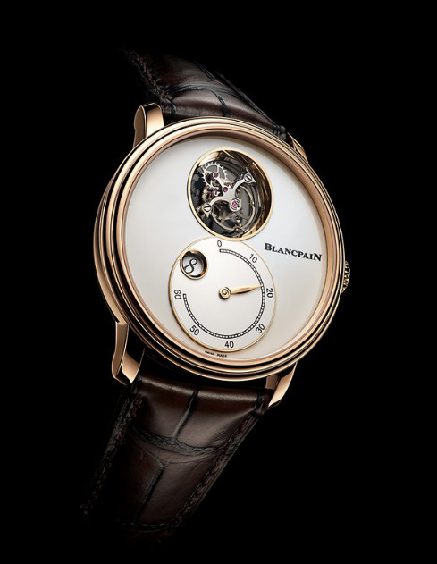 Blancpain- Villeret Tourbillon Volant Heure Sautante Minute Rétrograde - complications as watch aesthetics, shown on black background.