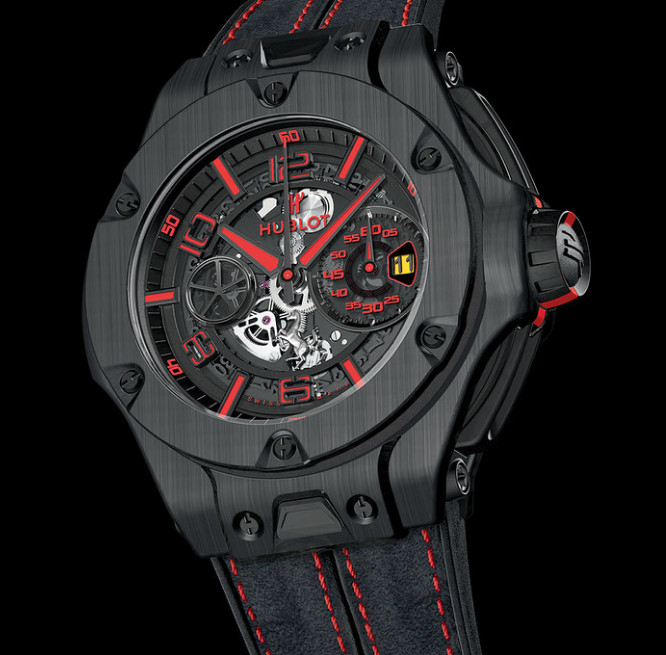 Hublot Big Bang Ferrari watch, grey brushed metal with red accents. Black background.