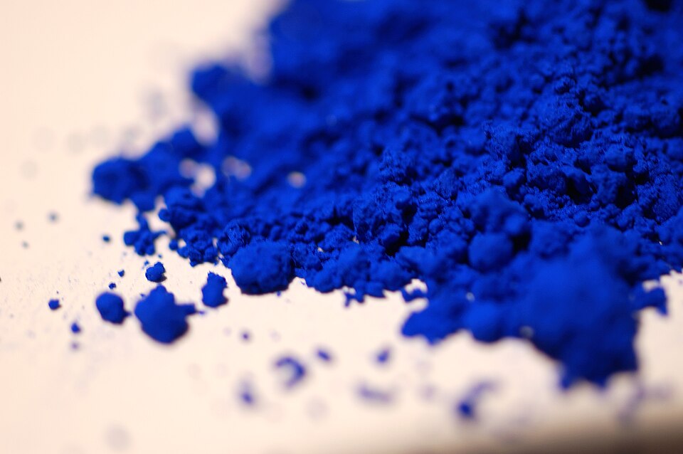 A pile of International Klein Blue pigment, shallow depth of field.