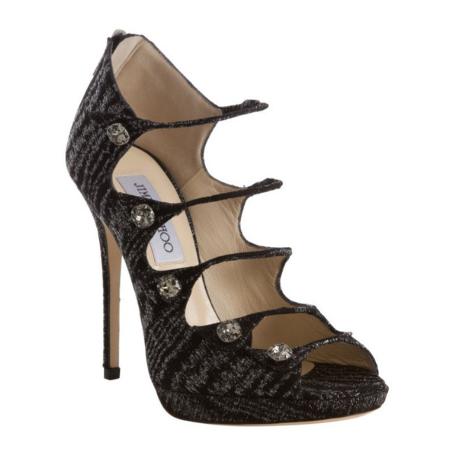 Jimmy Choo, black high-heeled shoe, isolated on white background - a British luxury brand.