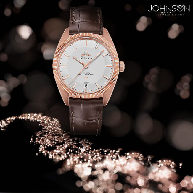 Omega Constellation Globemaster - golden ratio influenced watch aesthetic, with bokeh background of bright spots on black.