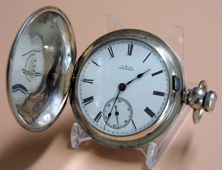 Waltham Pocket Watch, shown on a museum display stand