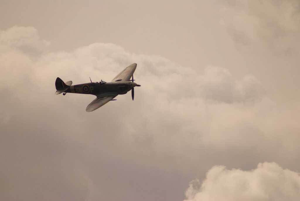 Spitfire flying through clouds - an example of beauty denoting functionality.