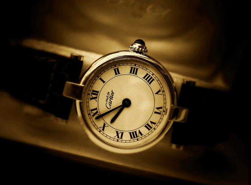 Cartier watch, sepia coloured image with vignetting.