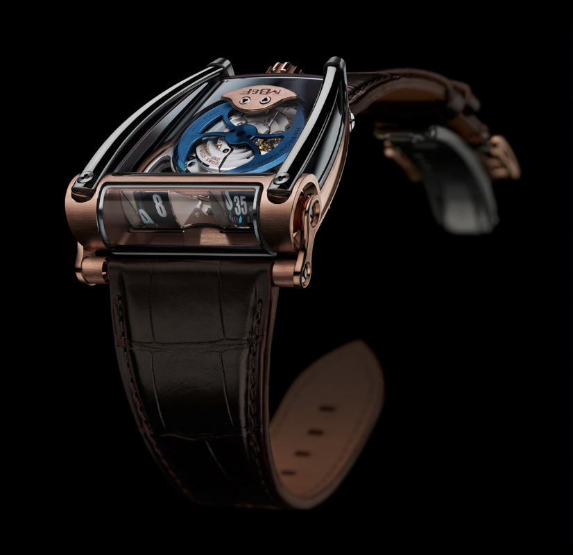 MB&F HM8 watch, with blue and copper-coloured accents and brown leather strap, isolated on a black background.