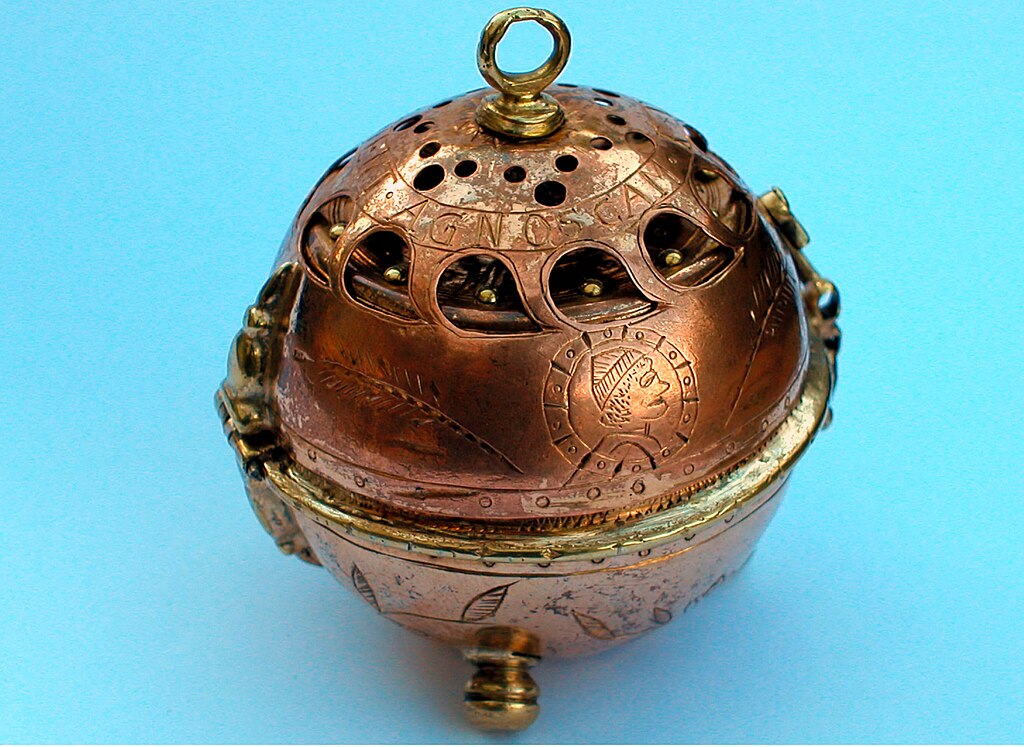 PHN  Watch, 1505, copper coloured sphere, on a blue background.