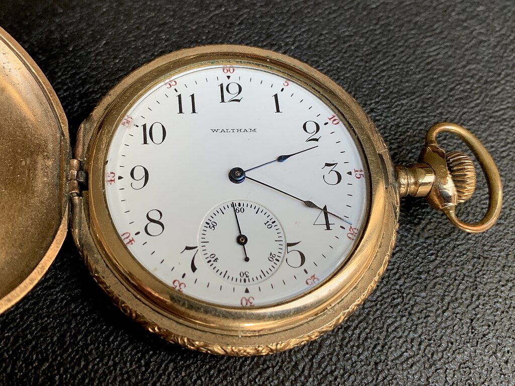 Waltham Riverside watch, pocket-watch, on a black leather background.