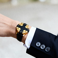 Cross #1 watch gold and ebony, worn by man in dark suit,Thumbnail