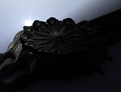 Poppy Seed-pod watch, blackened silver, lit from the rim. Thumbnail