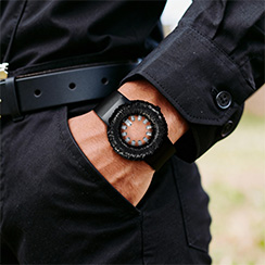 Tropical Crystal, black, worn on man's wrist. Thumbnail