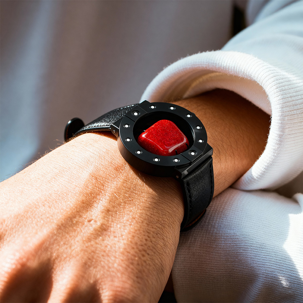 Stone-hold wristwatch in black with red jasper, worn on a man's wrist