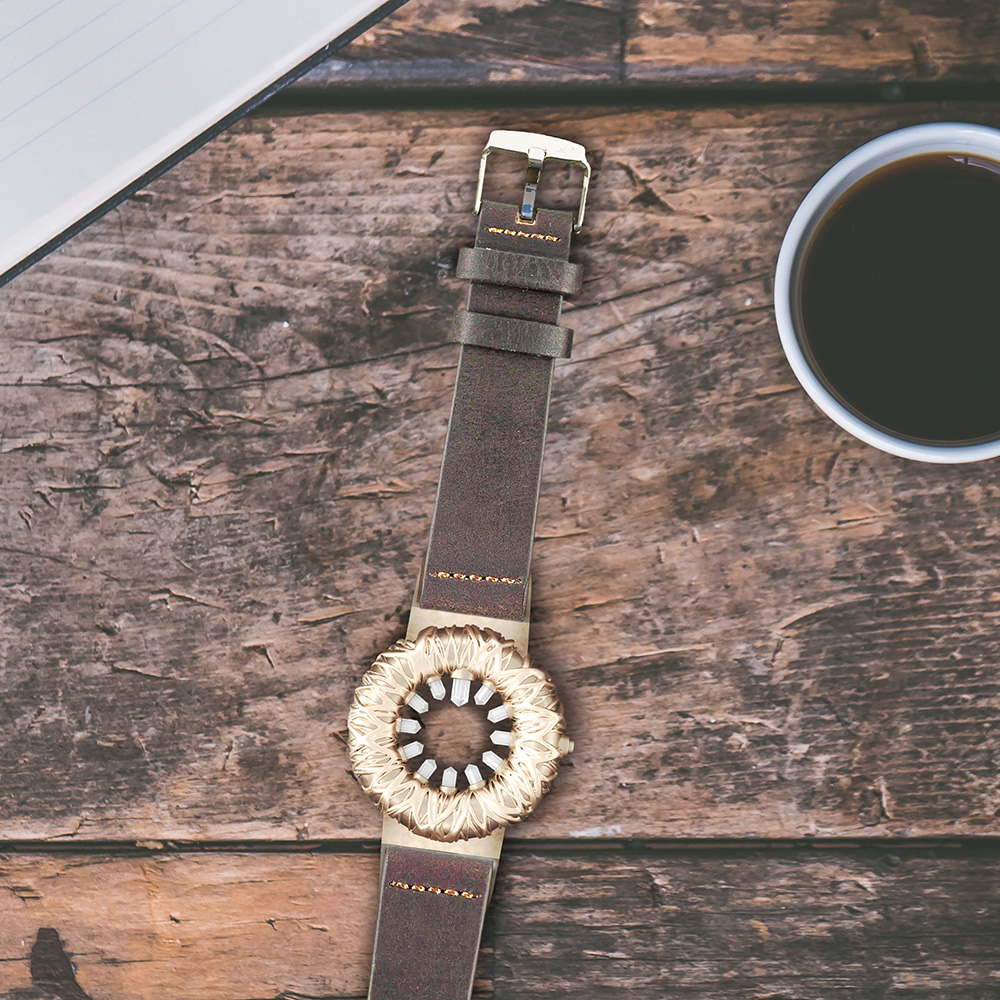 Tropical Crystal watch in bronze on tabletop vertical 1