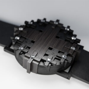 Cross #1 wristwatch in black patinated bronze and ebony on a white background, shallow depth of field