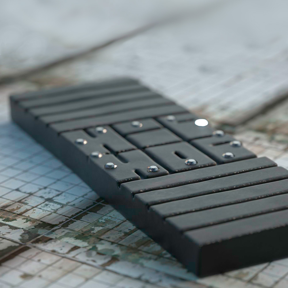 Hip Hop #1 watch in black, on a dirty tiled surface