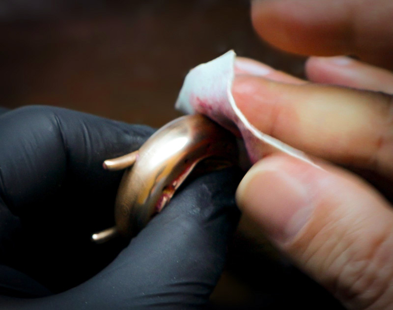 Polishing a Fractal Emergence watch body/case with diamond polishing paste on chamois leather.
