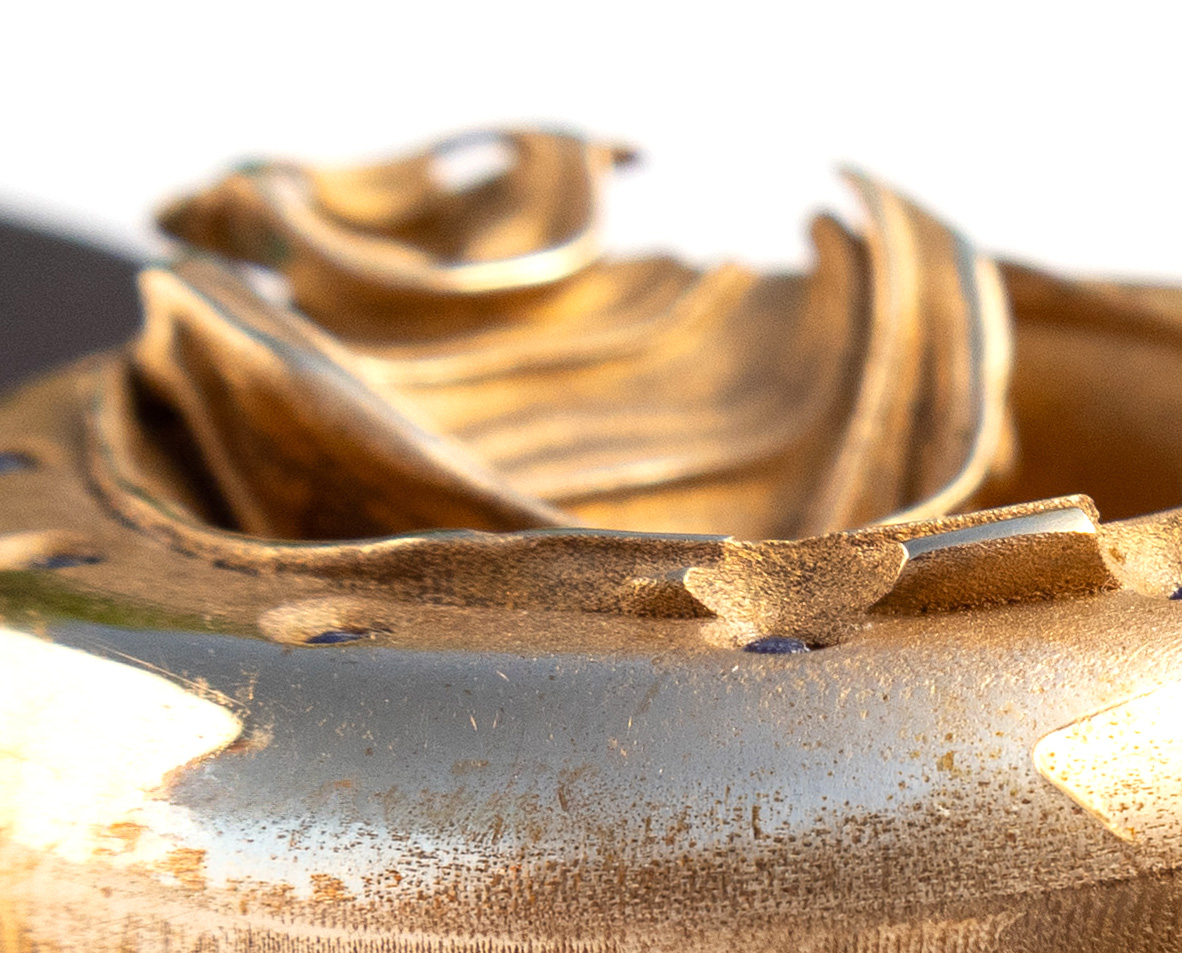 UnconstrainedTime Fractal Emergence wristwatch in bronze, closeup detail, shallow depth of field.