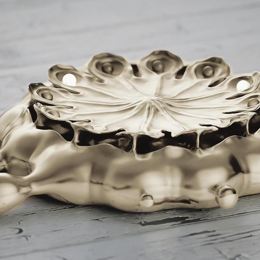 Poppy Seed Pod watch in white gold, closeup on distressed paint surface.