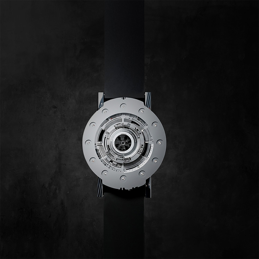 Techno-circle watch in aluminium, vertical shot against dark background.